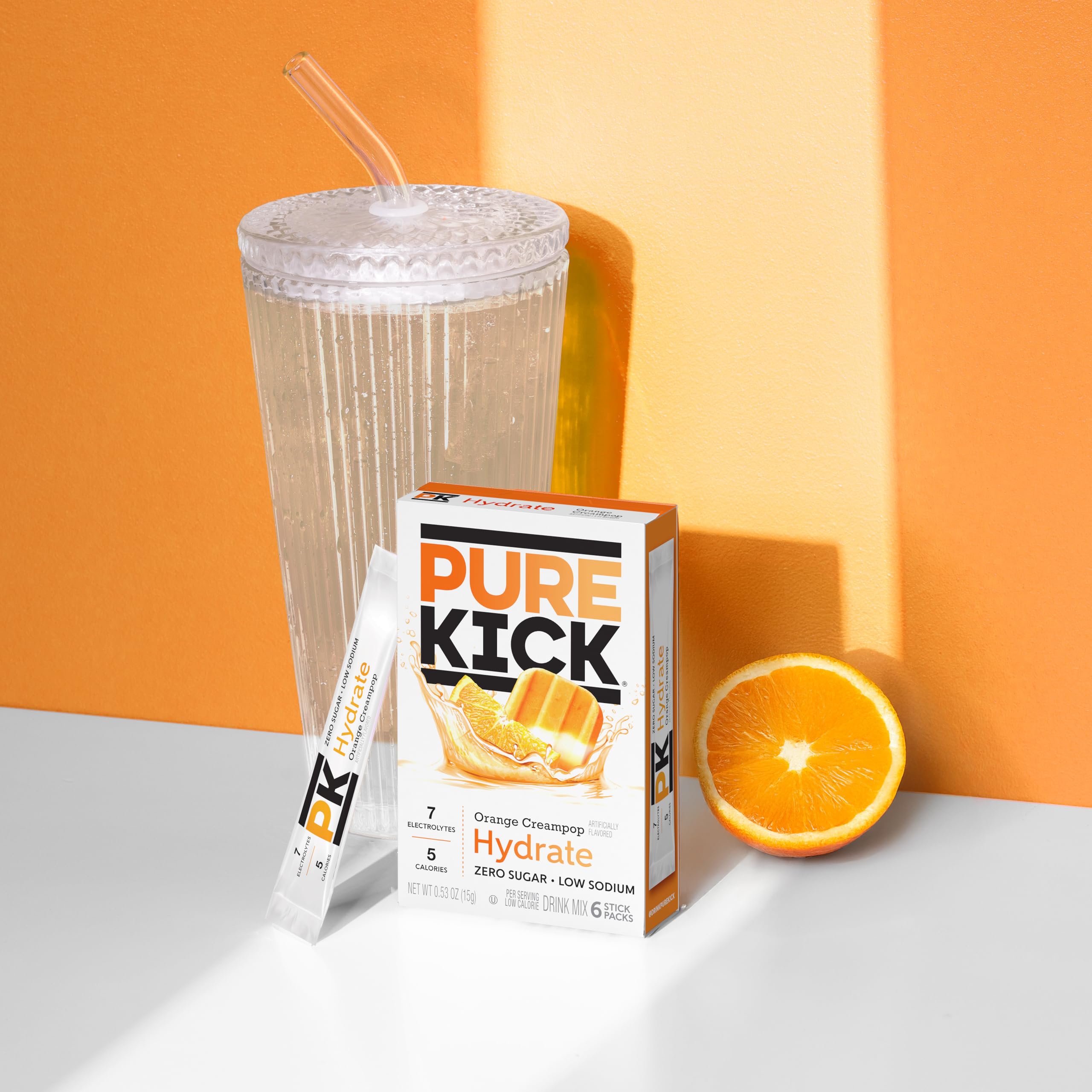 PURE KICK polvo naranja cremoso en cuchara destacando textura y sabor