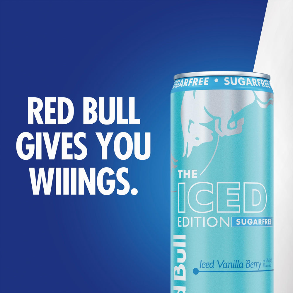 Red Bull lata en escritorio junto a portátil, estimula concentración