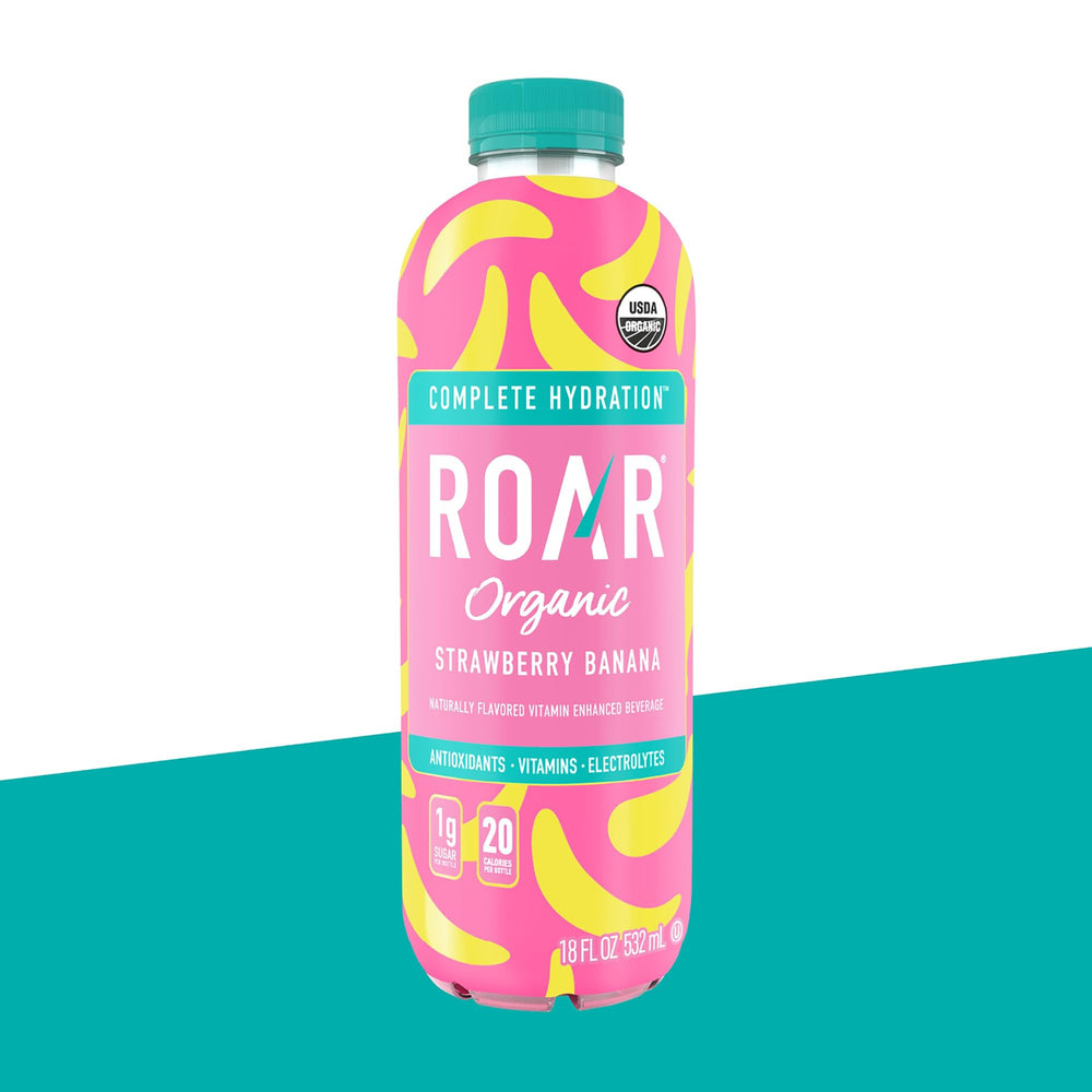ROAR botella junto a una regla para mostrar escala y tamaño