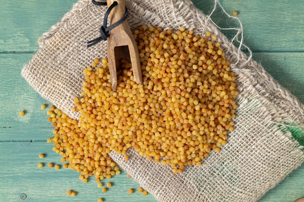 Sanniti detalle de perlas tostadas, textura granulada y retención de salsa