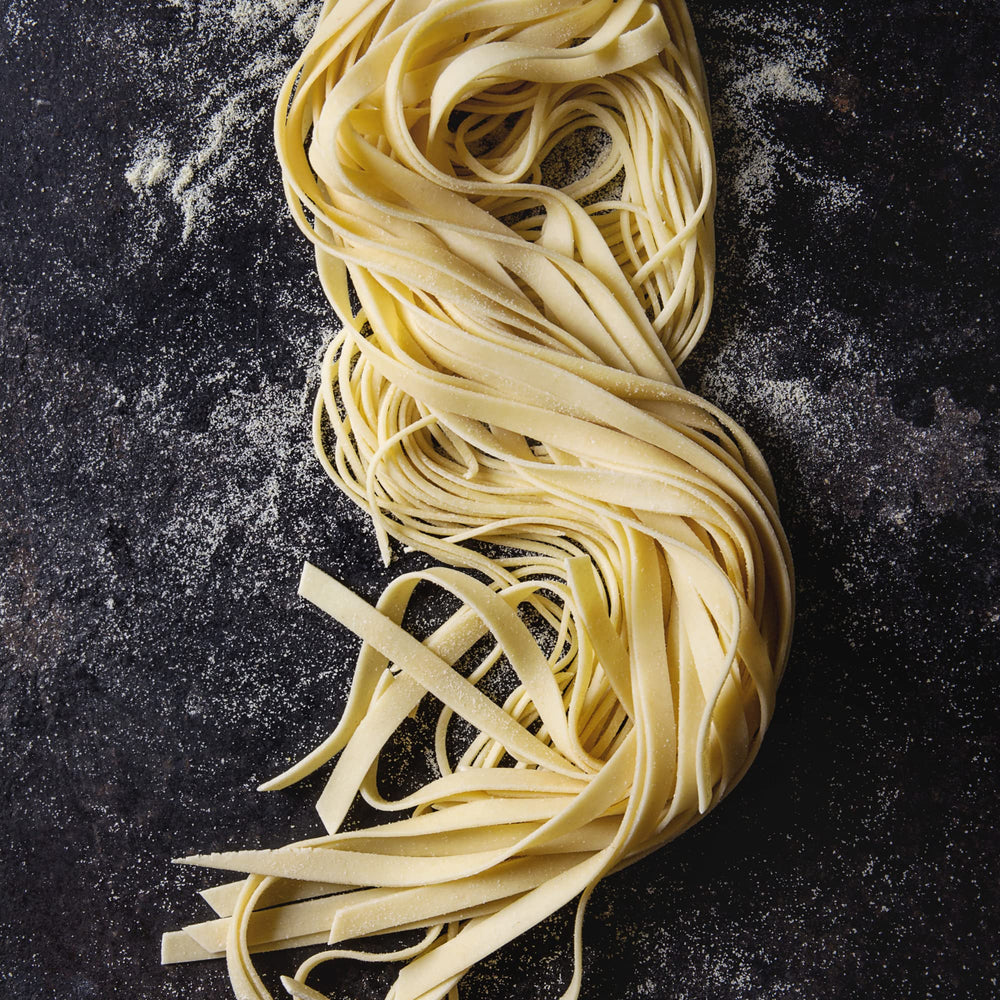 Sanniti tagliatelle cocinada en plato con salsa, aspecto apetitoso y buena absorción