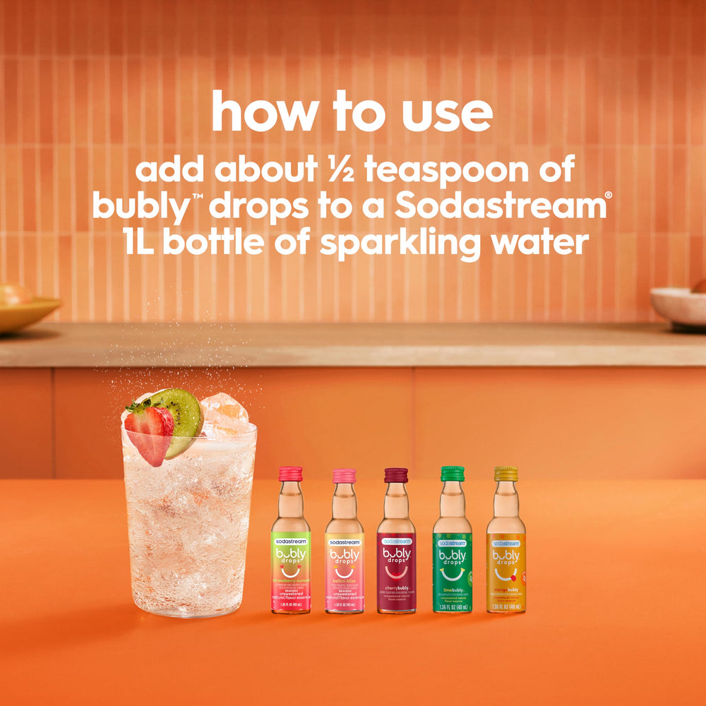 SodaStream gotas añadidas a agua con gas demostrando preparación rápida