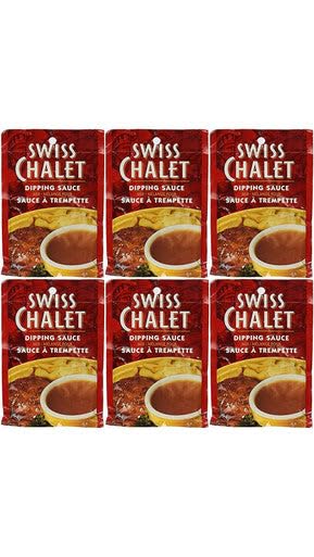 Caja con los seis sobres Swiss Chalet apilados preparada para despensa y fiestas
