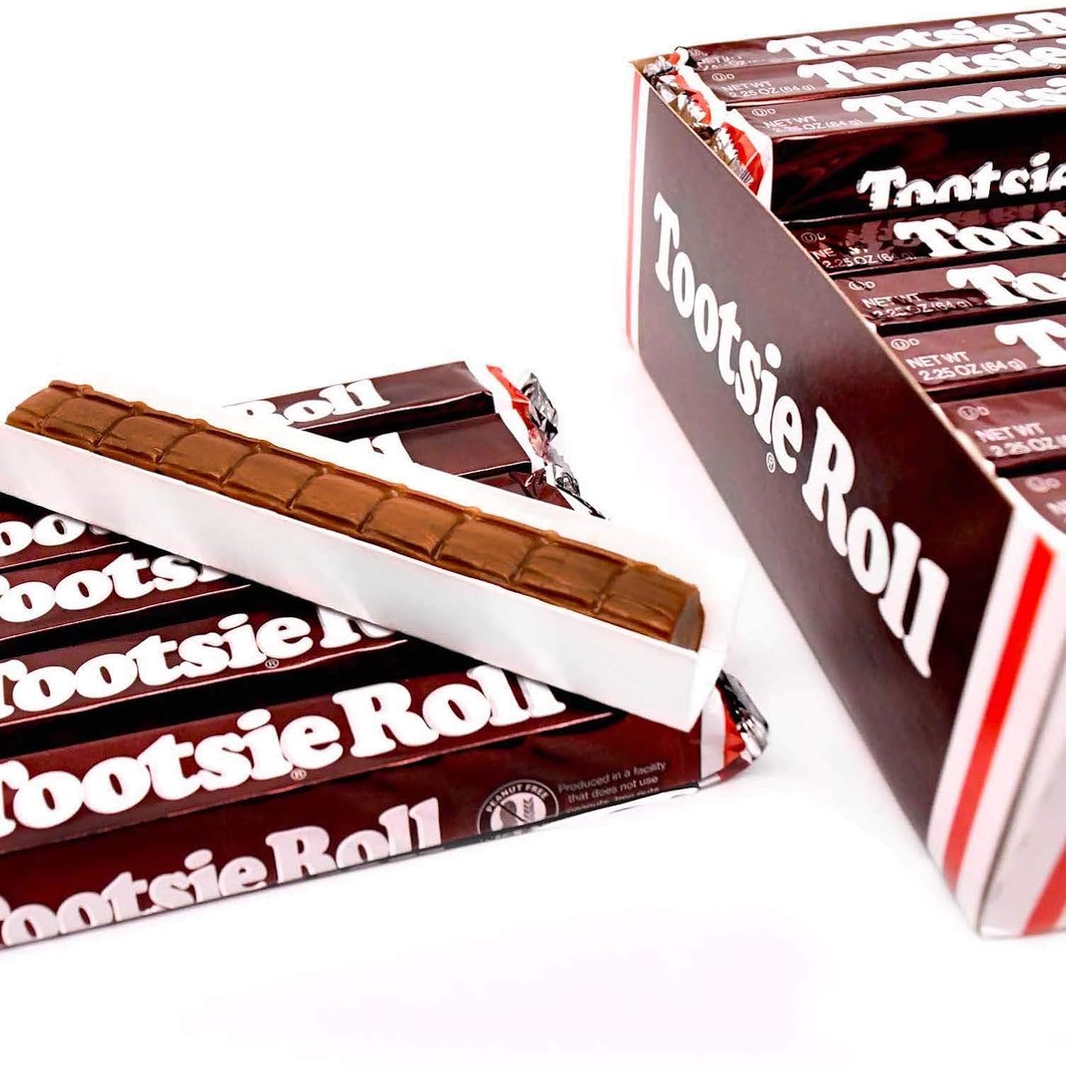 Corte de barra Tootsie Roll mostrando su textura masticable, Tootsie Roll sabroso