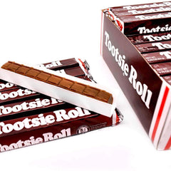 Corte de barra Tootsie Roll mostrando su textura masticable, Tootsie Roll sabroso