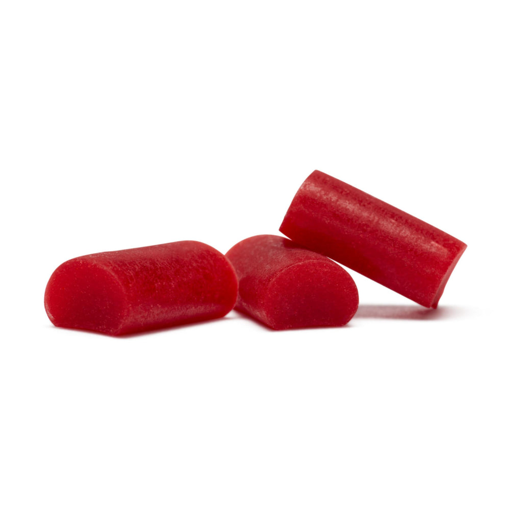 Comparación de tamaño Twizzlers Nibs con mano para visualizar porción conveniente