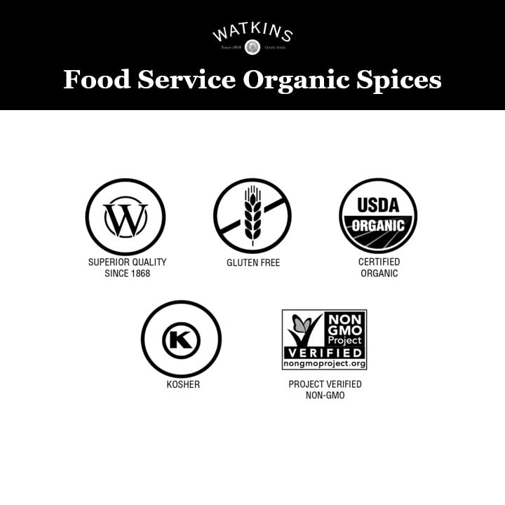 Watkins comino escena cocina botella en mesa con ingredientes