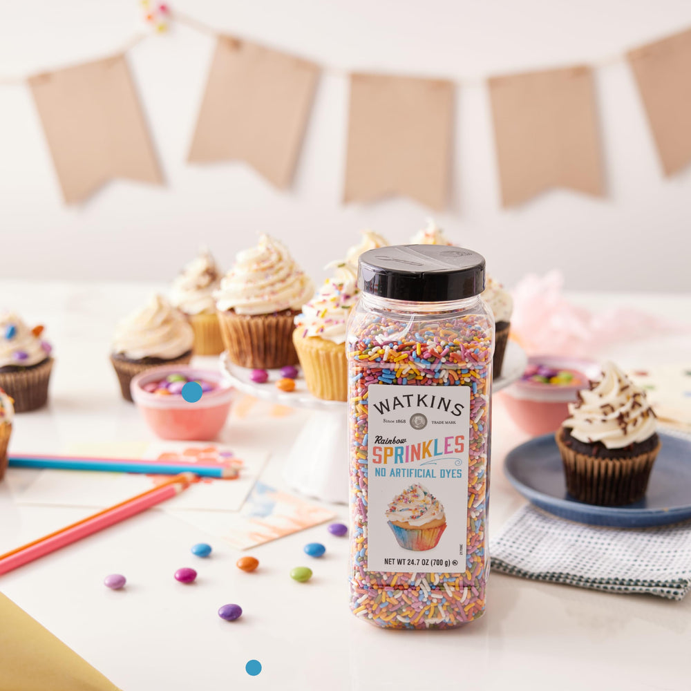 Watkins sprinkles en mesa festiva, decora postres para celebraciones