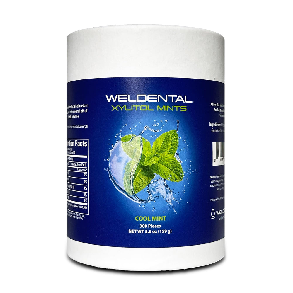 WELdental tubo de cartón frontal muestra empaque reciclable y recarga sostenible