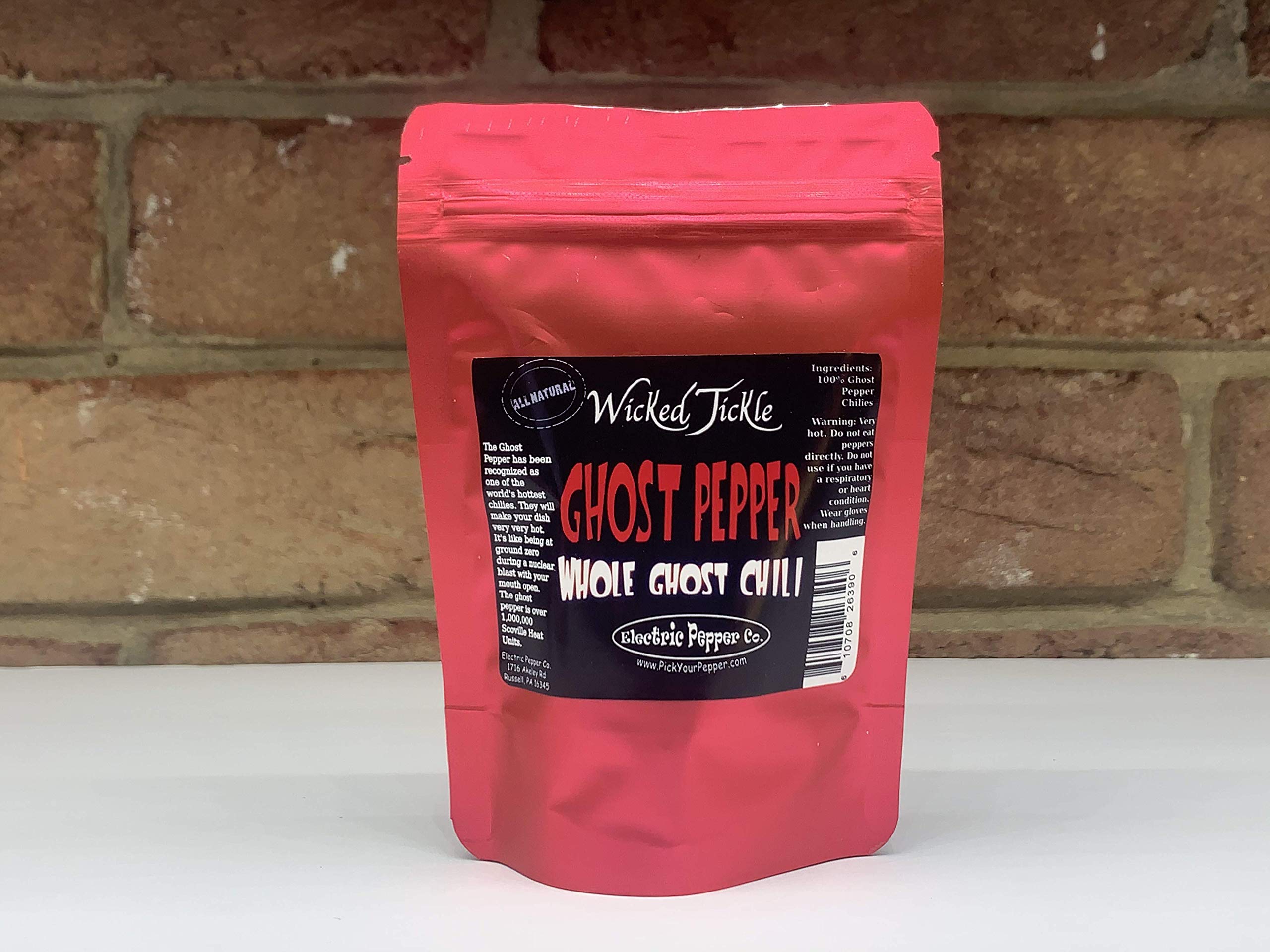 Wicked Tickle Ghost Peppers en primer plano, evidencia picor afrutado y calidad