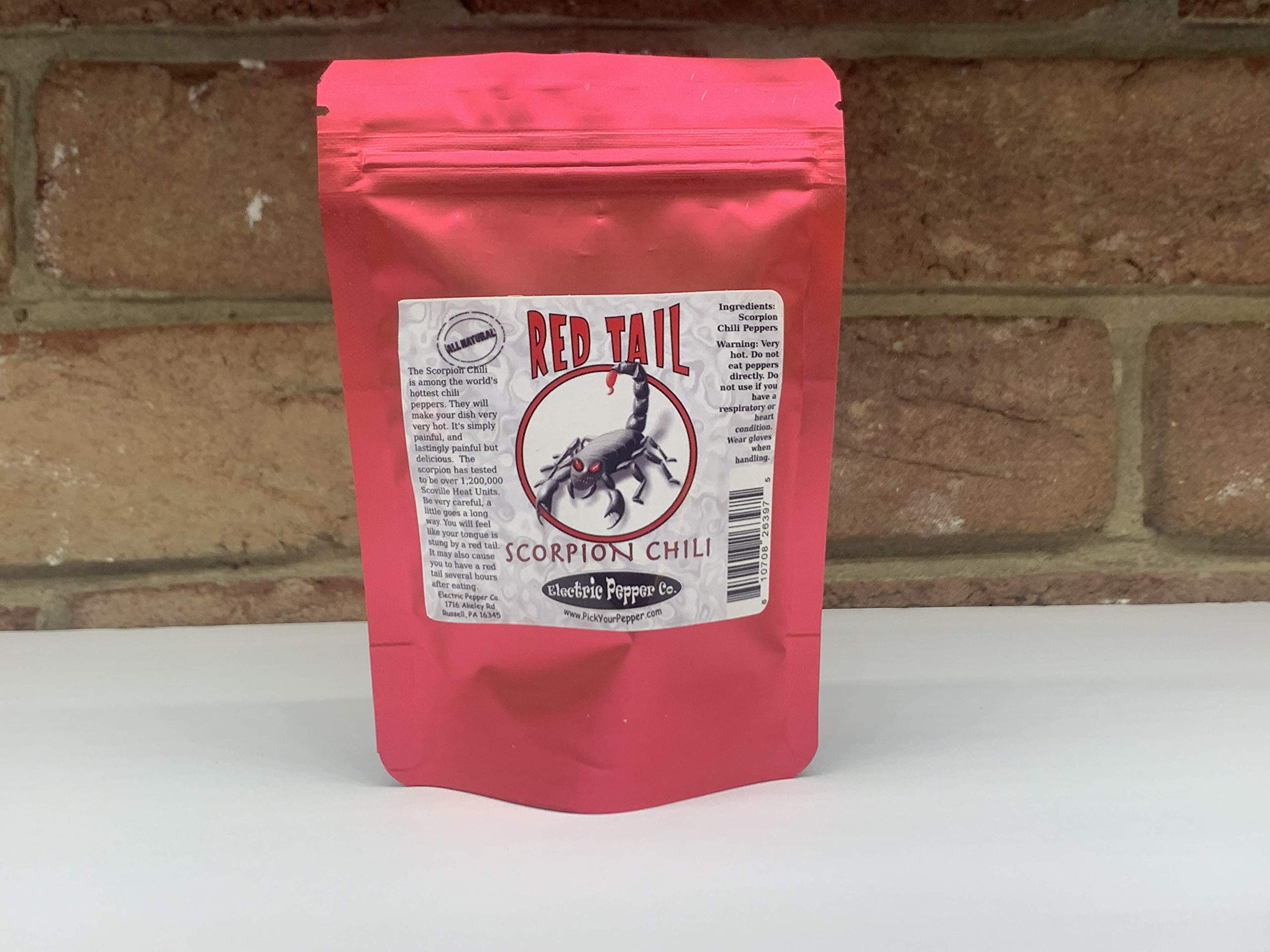 Wicked Tickle Trinidad Moruga Scorpion en fila, muestra forma y potencia progresiva