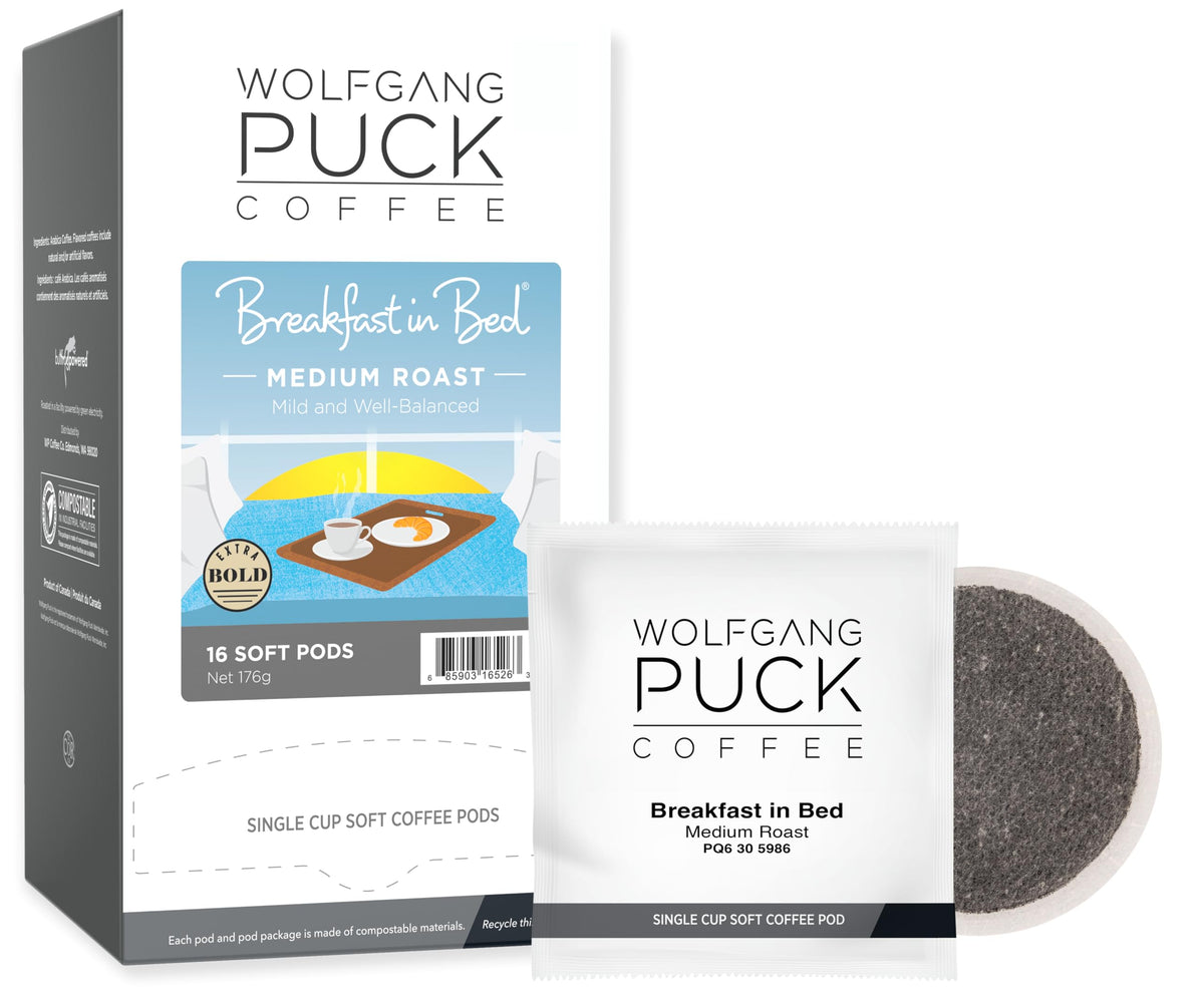 Wolfgang Puck caja delantera Breakfast in Bed mostrando 16 cápsulas y beneficios compostables